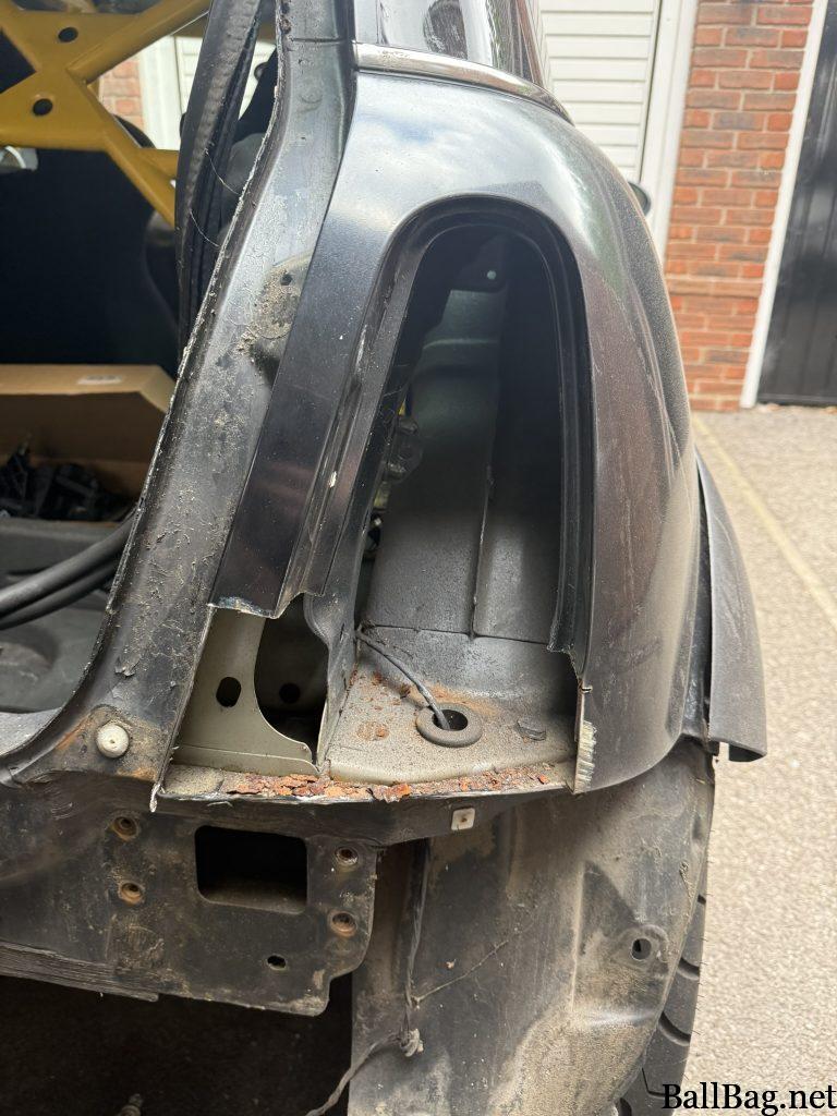 Rust cut away from the rear of the car